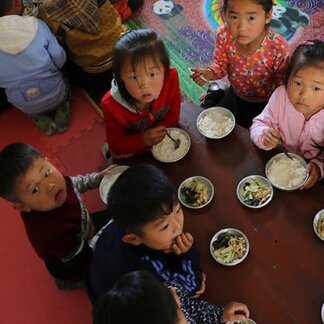 Children eating fortified foods in WFP-supported nursery in Sinwon County, DPR Korea